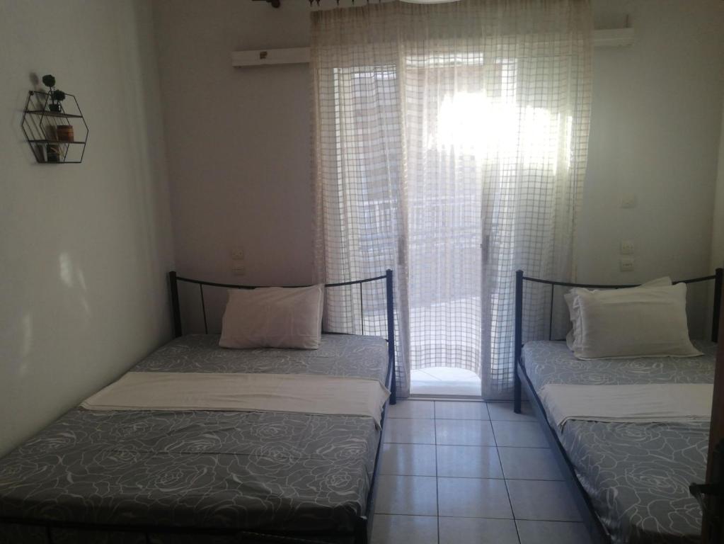 Posteľ alebo postele v izbe v ubytovaní Eleni Antonouli Rooms