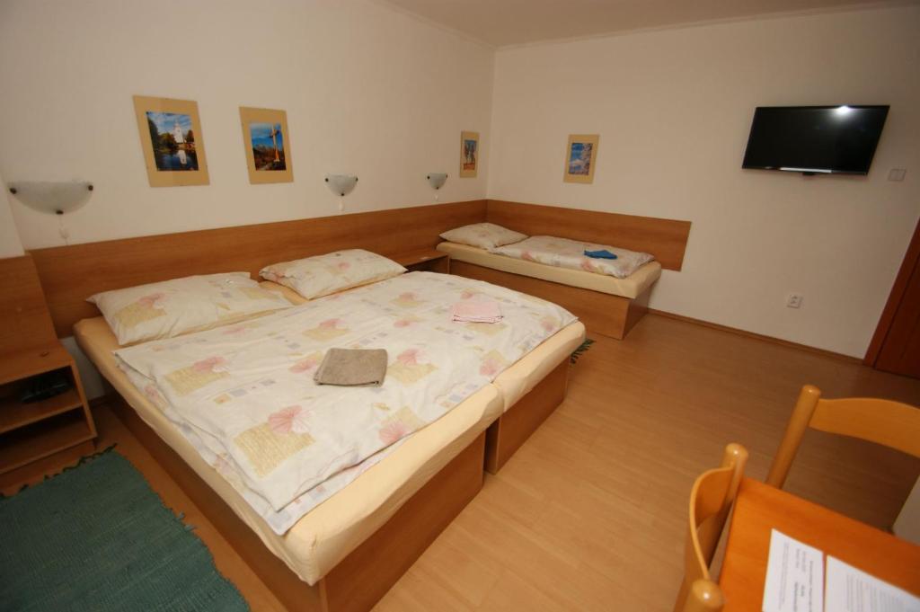 Postel nebo postele na pokoji v ubytování Vila Ema