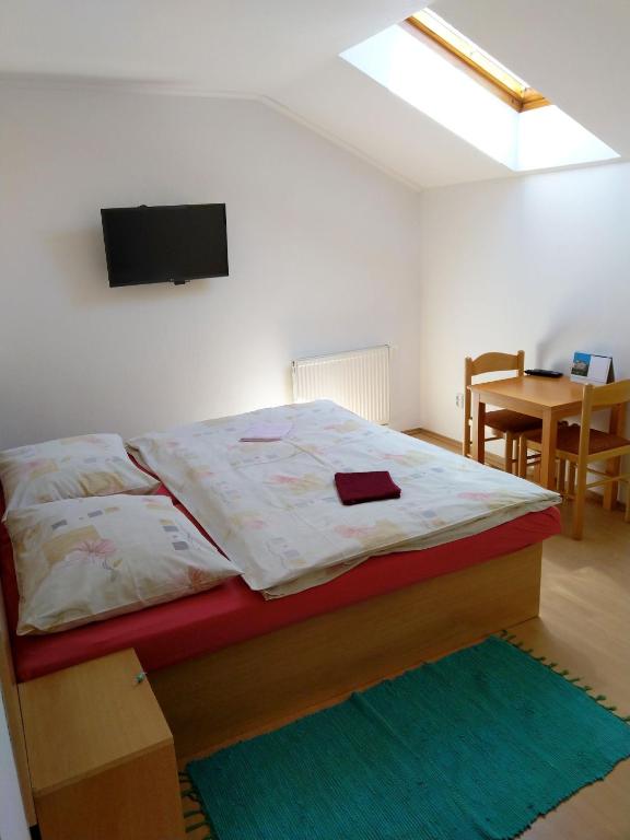 Postel nebo postele na pokoji v ubytování Vila Ema