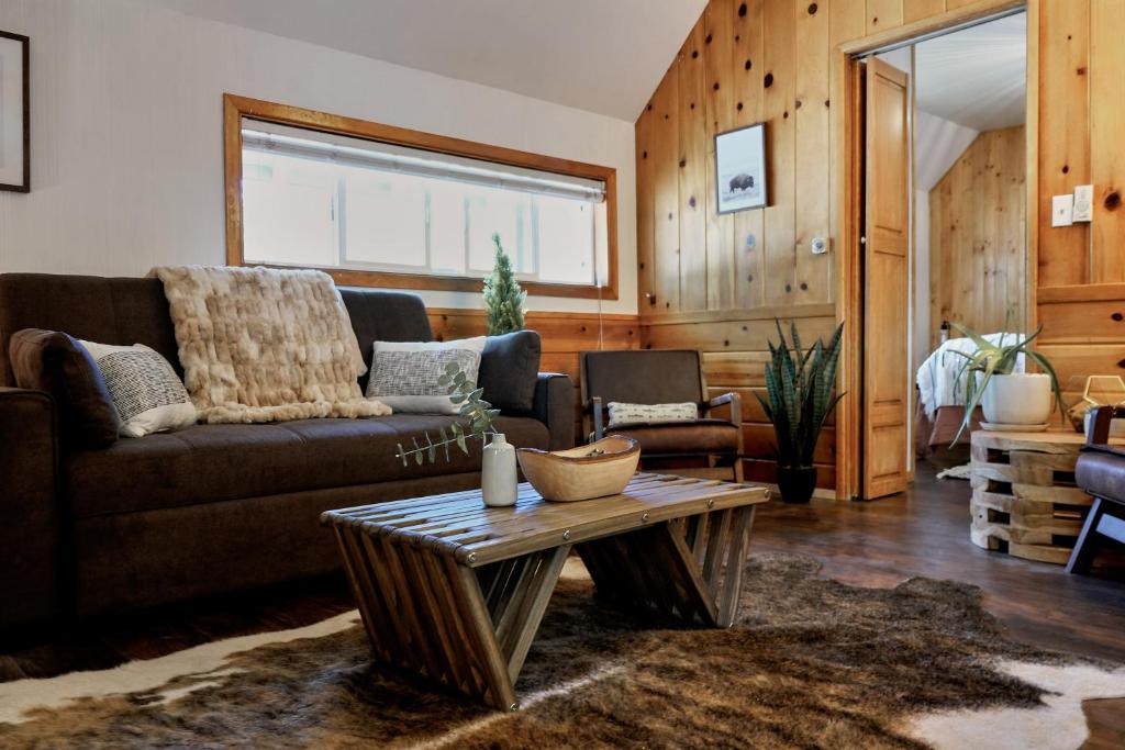 a living room filled with furniture and a window at Lake Front Cabins in June Lake