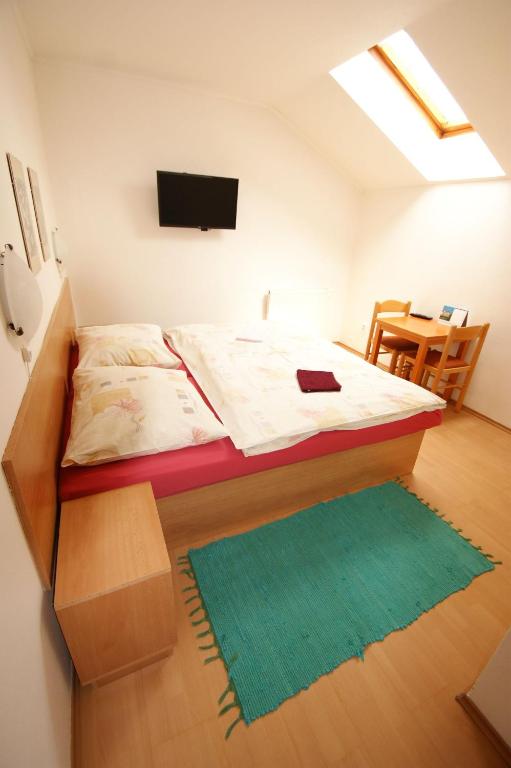 Postel nebo postele na pokoji v ubytování Vila Ema