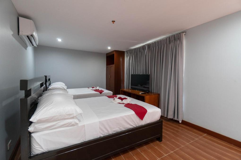 Postel nebo postele na pokoji v ubytování One Averee Bay Hotel