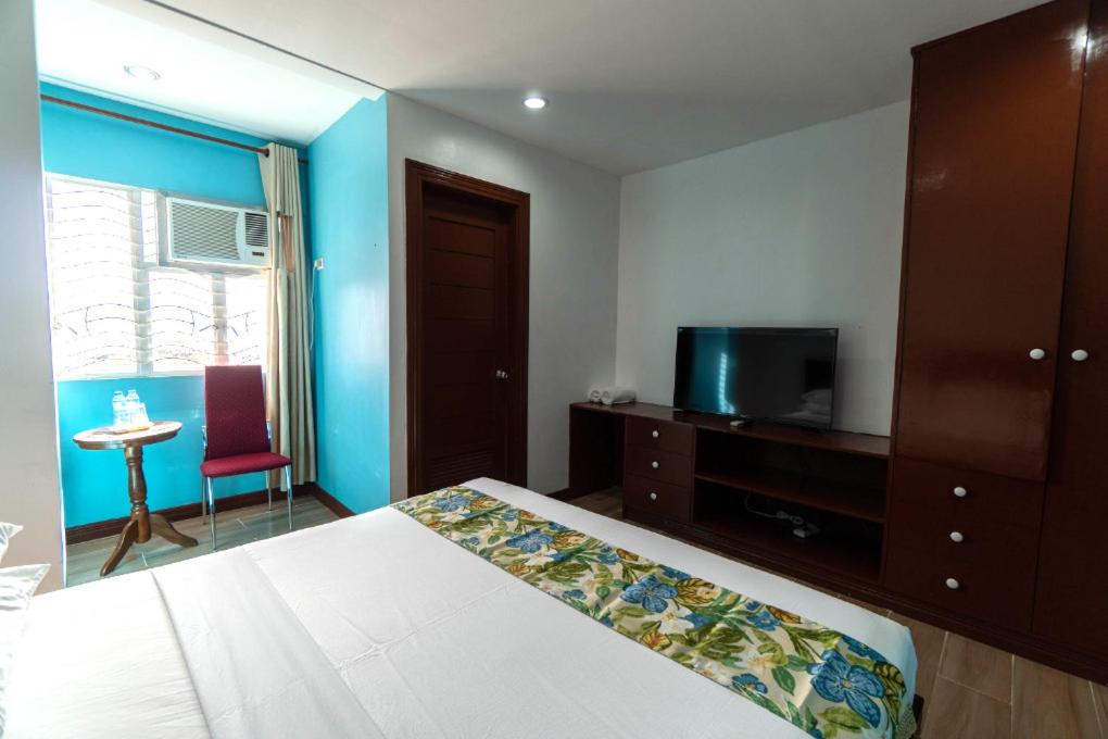Postel nebo postele na pokoji v ubytování One Averee Bay Hotel