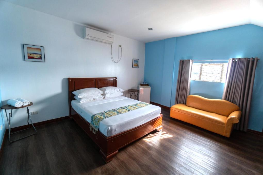 Postel nebo postele na pokoji v ubytování One Averee Bay Hotel