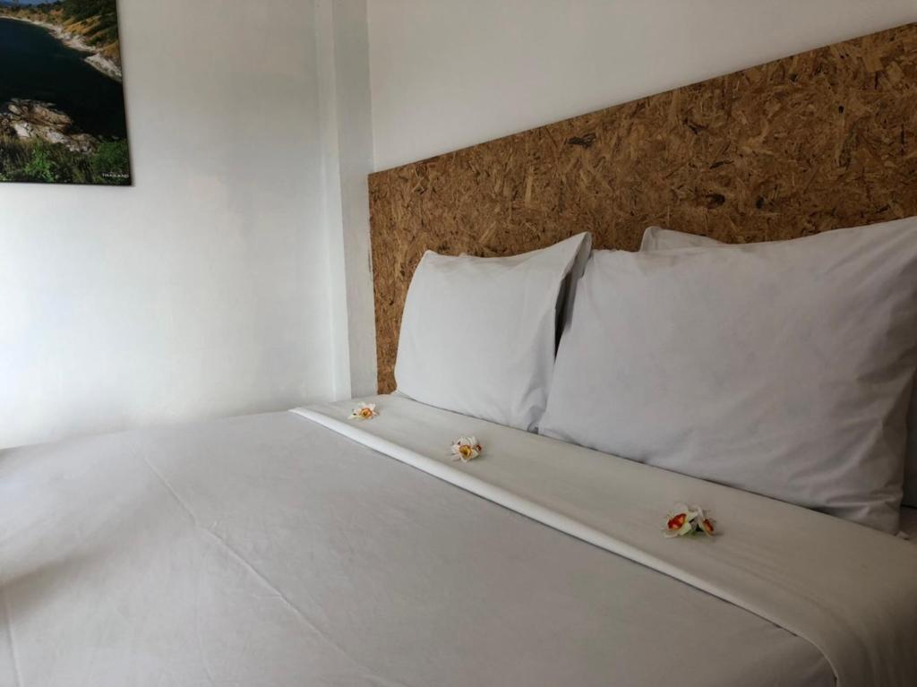 Postel nebo postele na pokoji v ubytování Baan Anattaya Koh yao noi