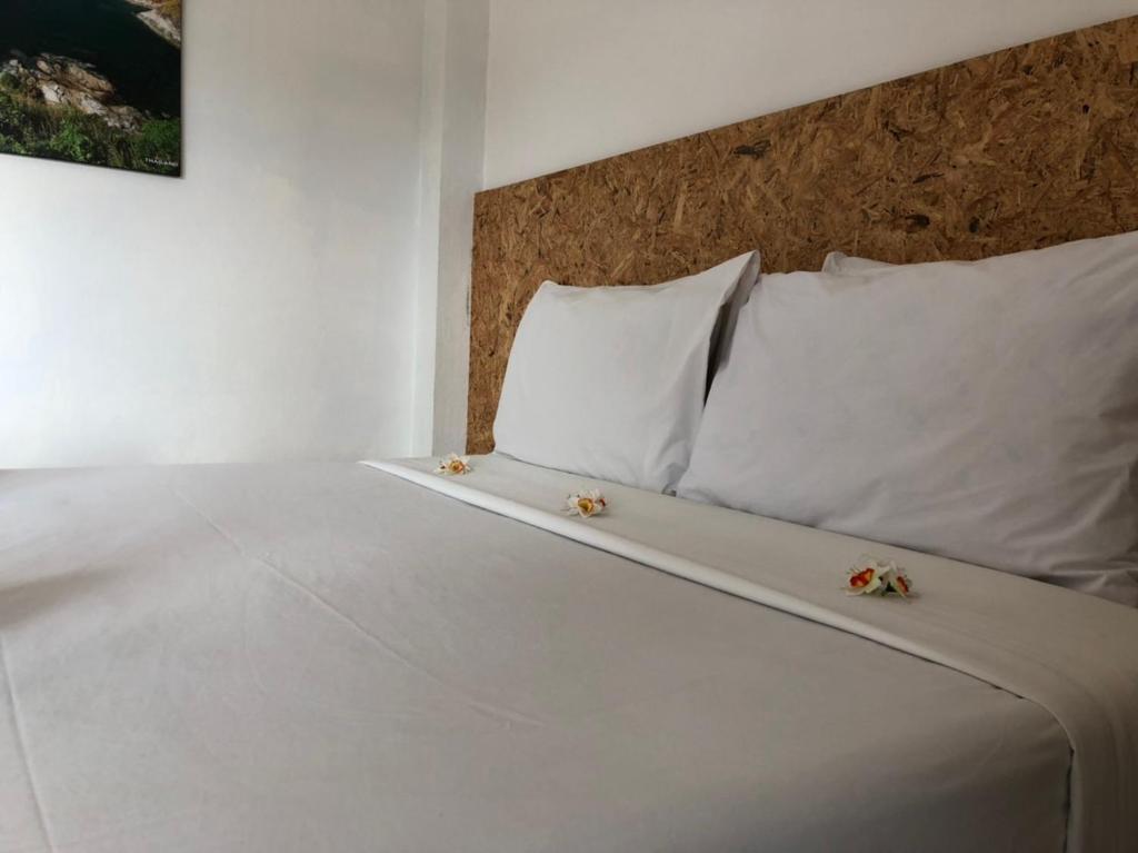 Postel nebo postele na pokoji v ubytování Baan Anattaya Koh yao noi