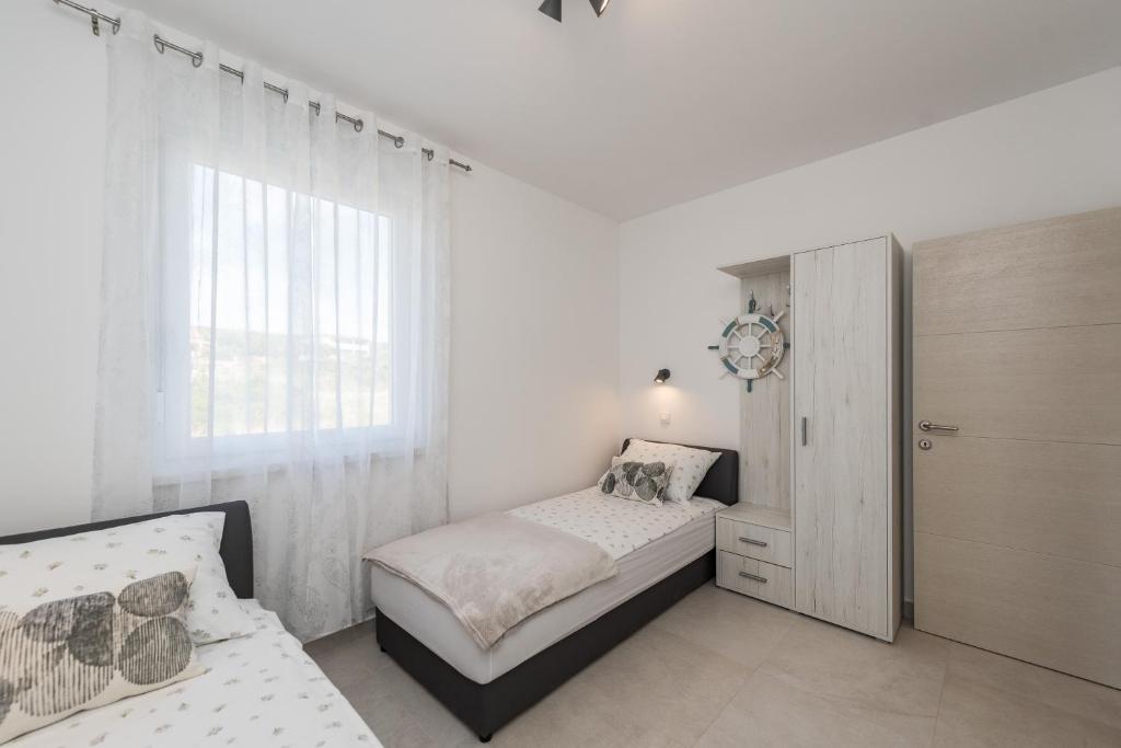 Postel nebo postele na pokoji v ubytování Villa Palmarosa