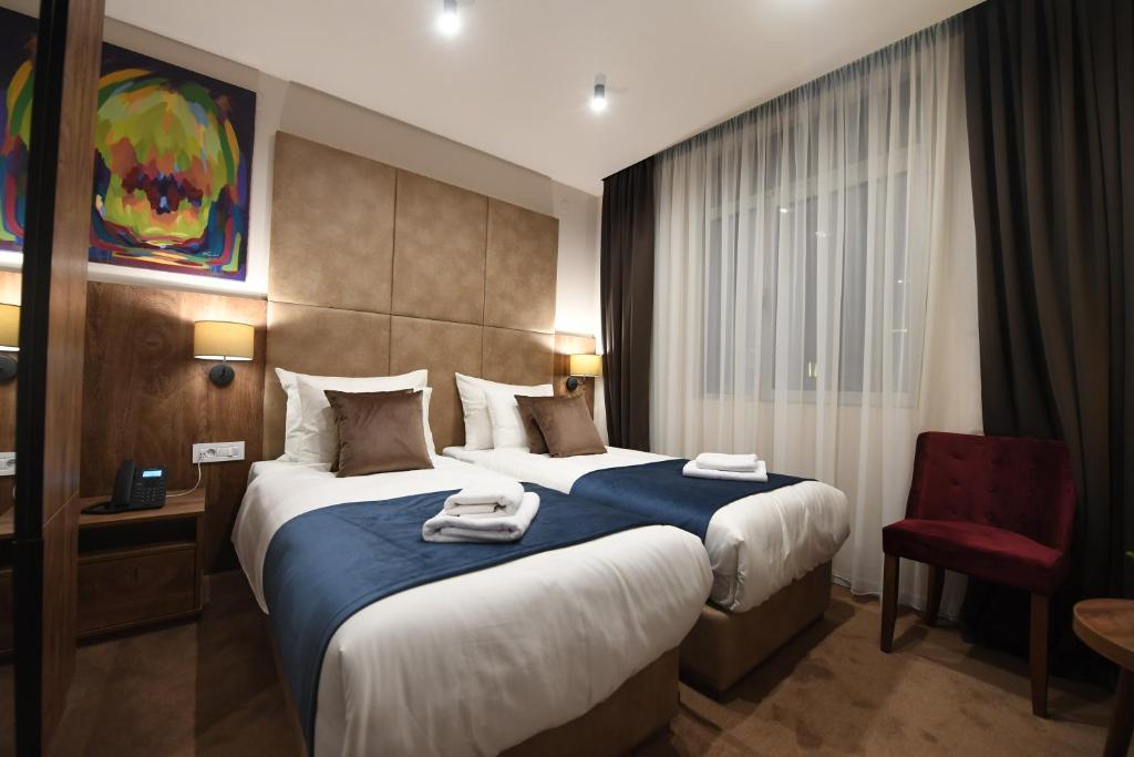 Postel nebo postele na pokoji v ubytování Hammeum Hotel