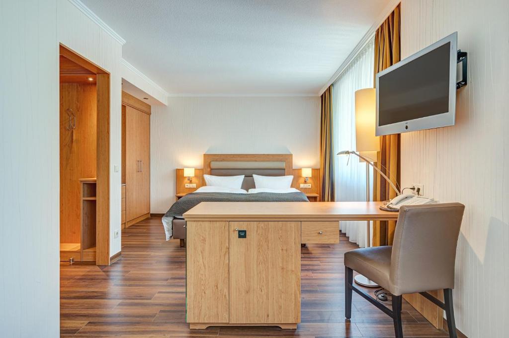 Postel nebo postele na pokoji v ubytování Komforthotel Kaiserhof