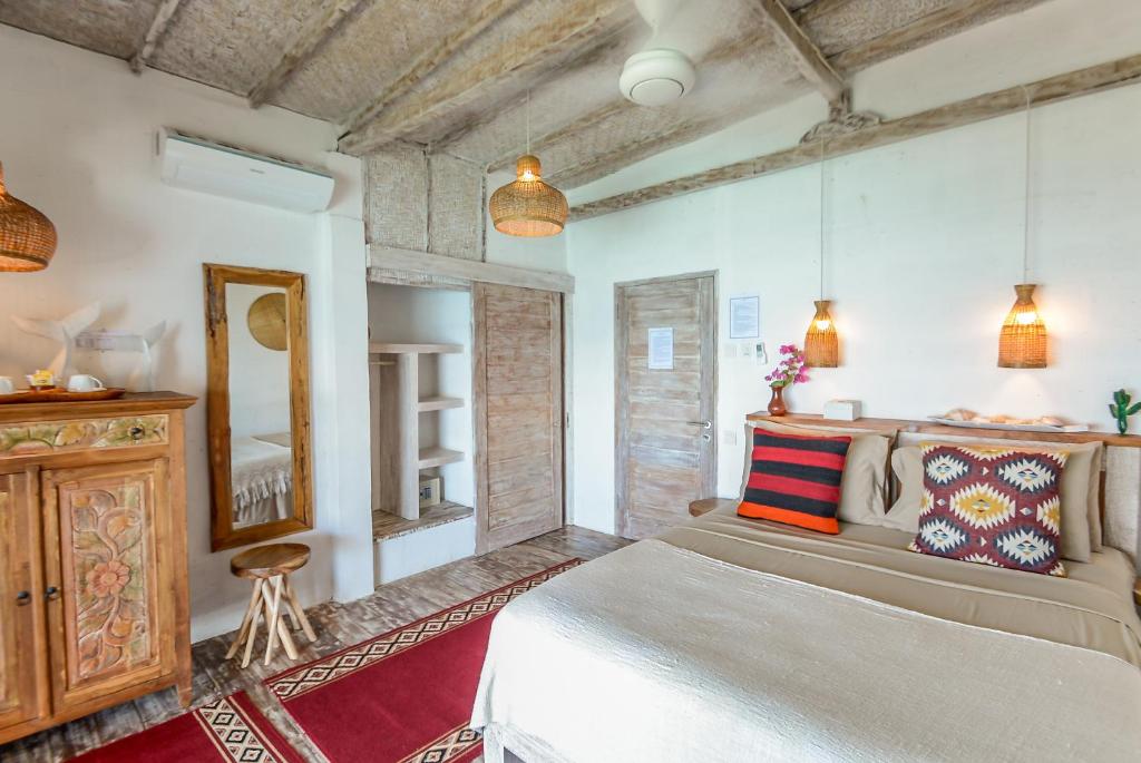Postel nebo postele na pokoji v ubytování Le Cliff Bali