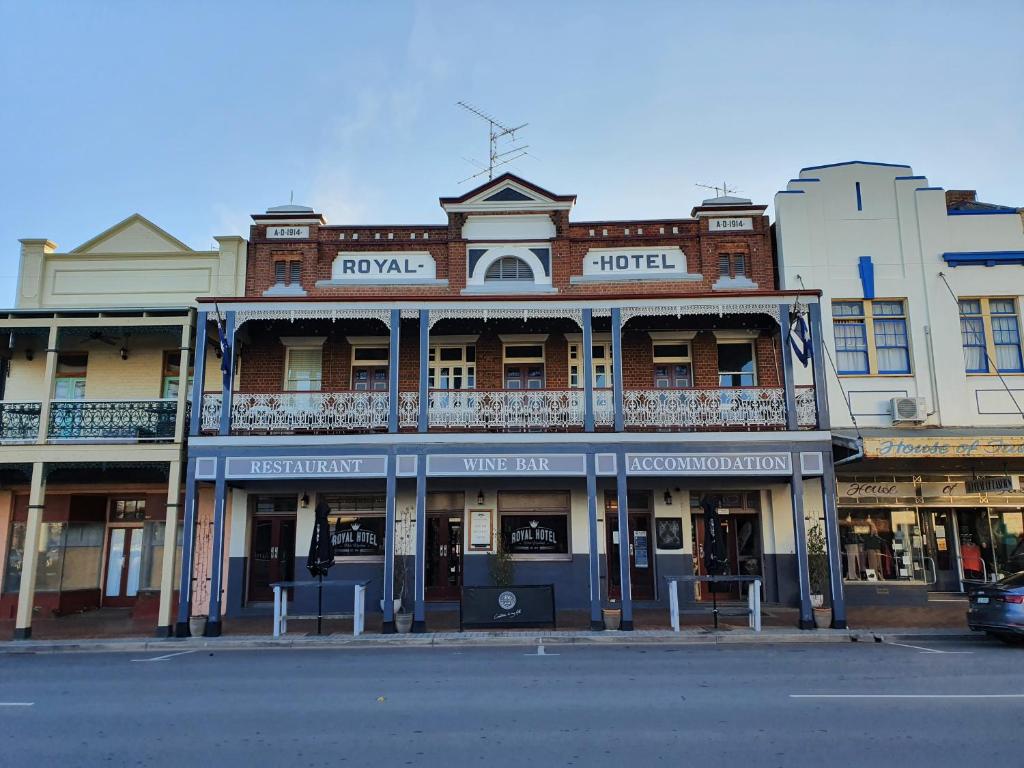 an old building on the corner of a street at The Royal Hotel in West Wyalong