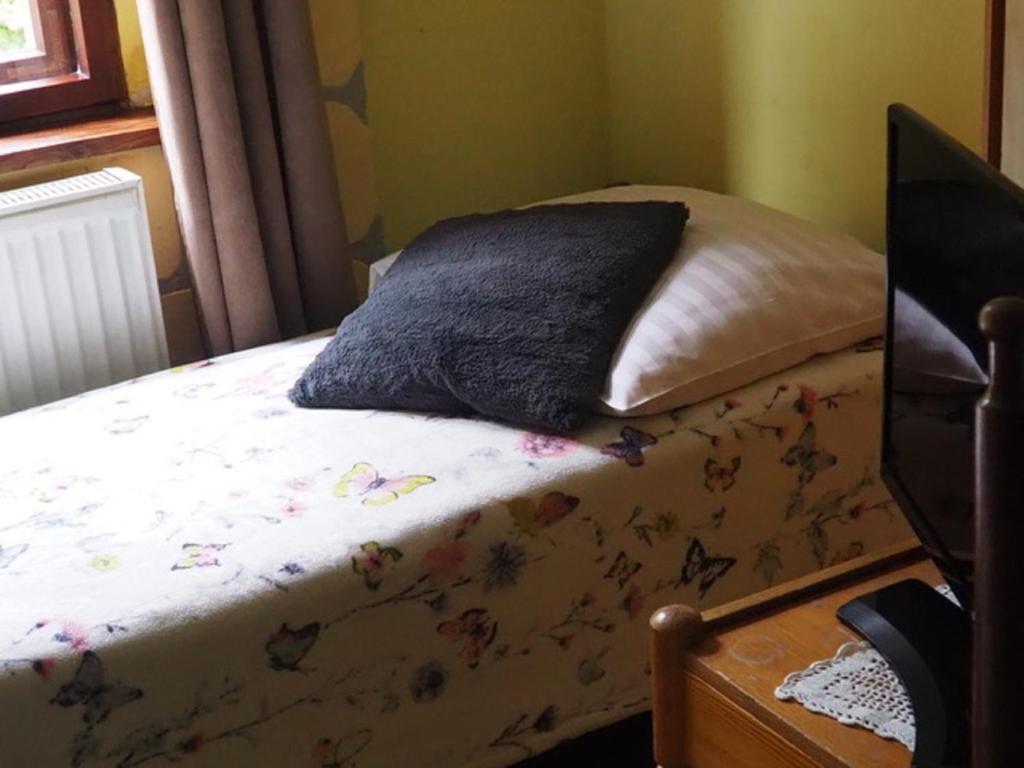 Postel nebo postele na pokoji v ubytování Zacisze Trzech Gór