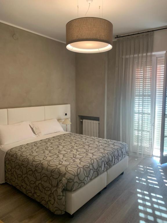 Postel nebo postele na pokoji v ubytování Hotel Conca D'Oro ***S