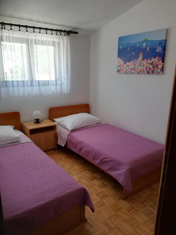 Posteľ alebo postele v izbe v ubytovaní Apartman Čupić