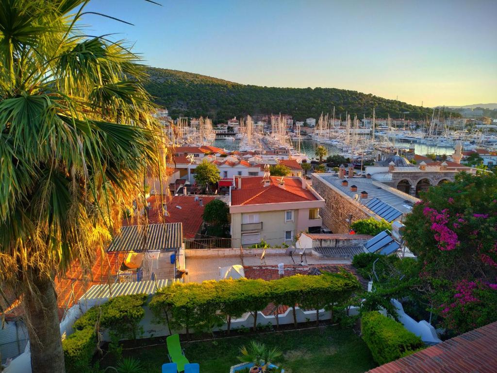 a view of a city with a harbor at Yalcin Hotel in Çeşme