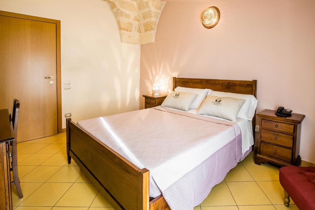 Postel nebo postele na pokoji v ubytování Laurito Resort & Spa