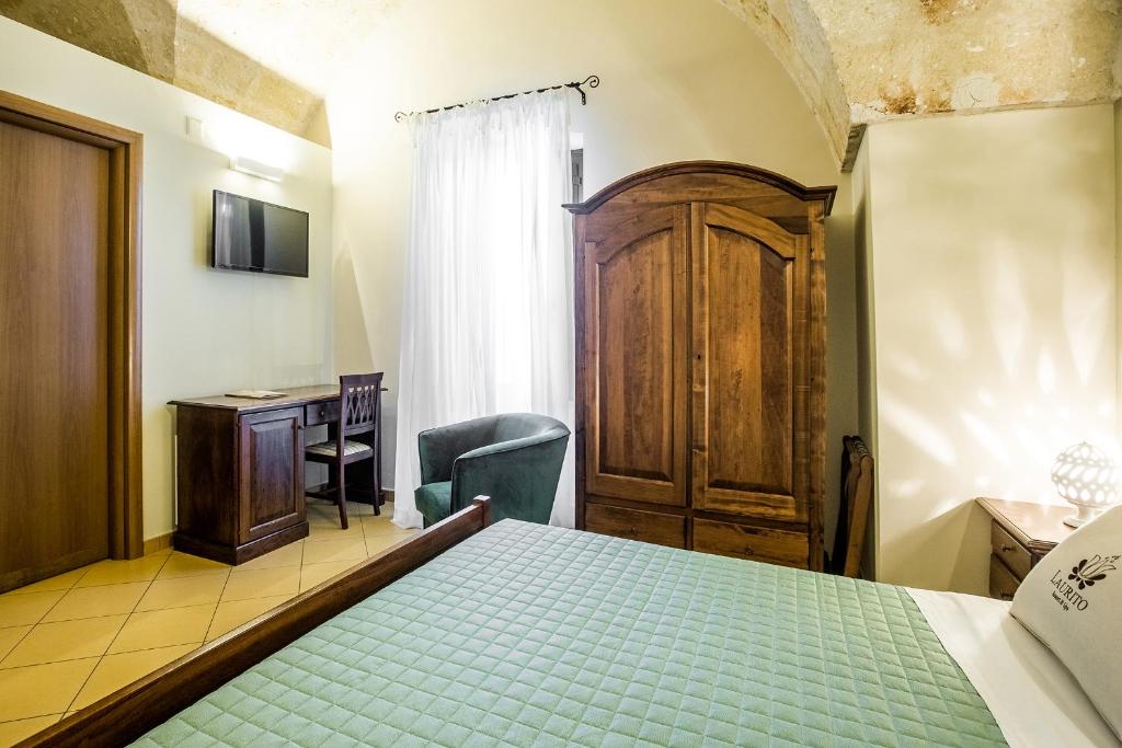 Postel nebo postele na pokoji v ubytování Laurito Resort & Spa