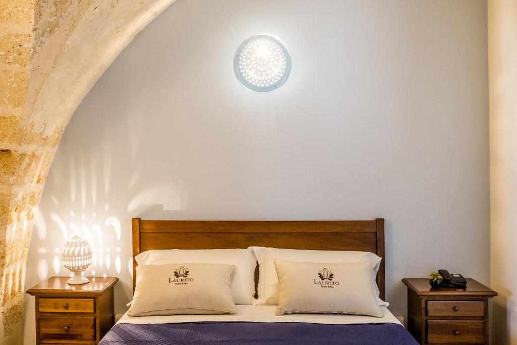 Postel nebo postele na pokoji v ubytování Laurito Resort & Spa