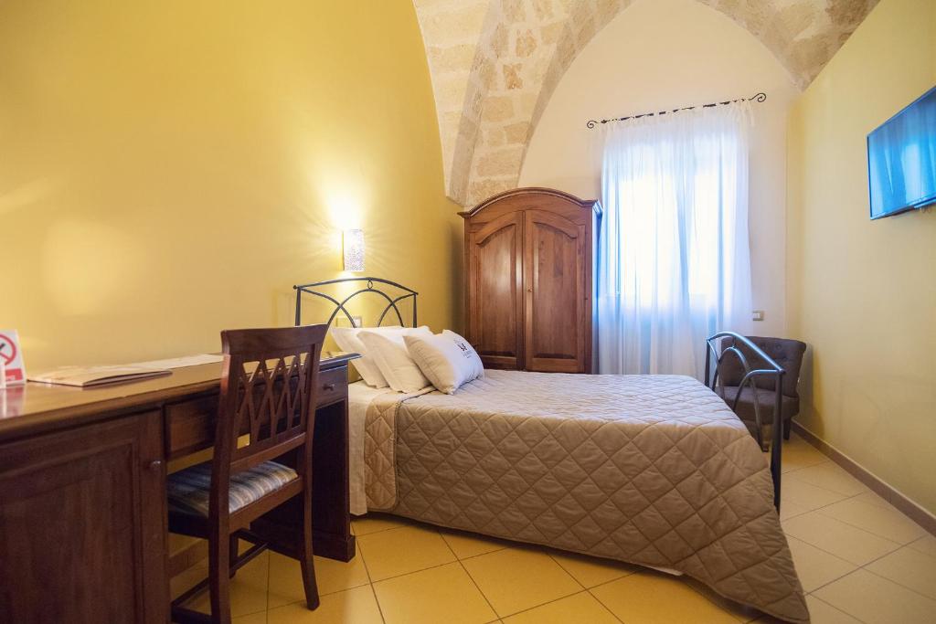 Postel nebo postele na pokoji v ubytování Laurito Resort & Spa