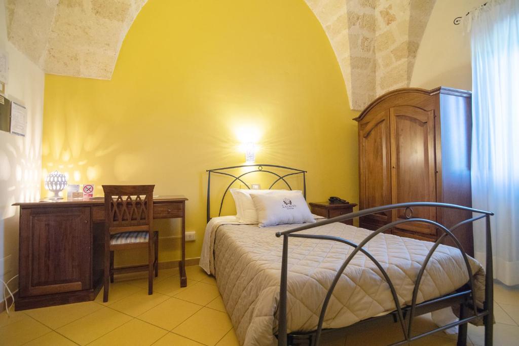 Postel nebo postele na pokoji v ubytování Laurito Resort & Spa