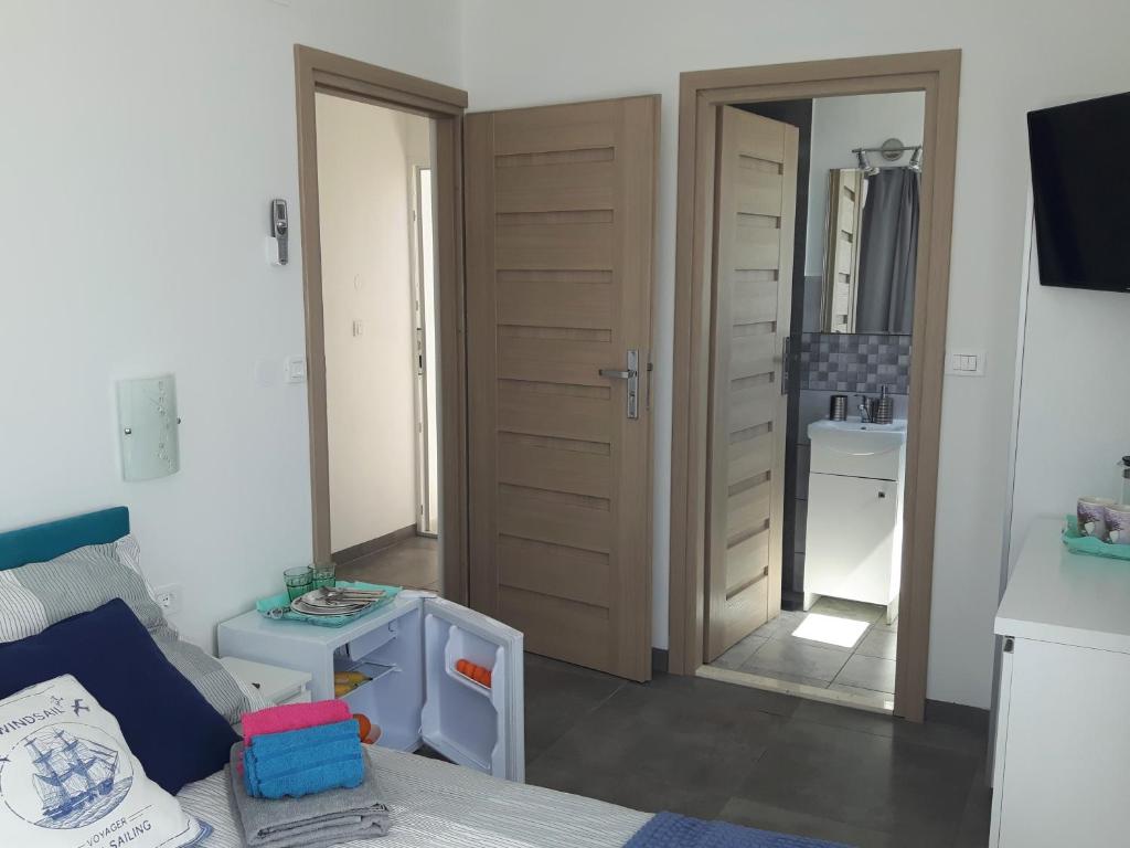 Postel nebo postele na pokoji v ubytování Apartmani Dalmacjia