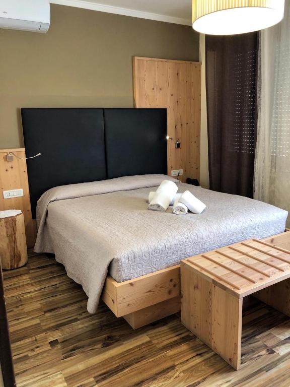 Postel nebo postele na pokoji v ubytování Locanda Montegrappa
