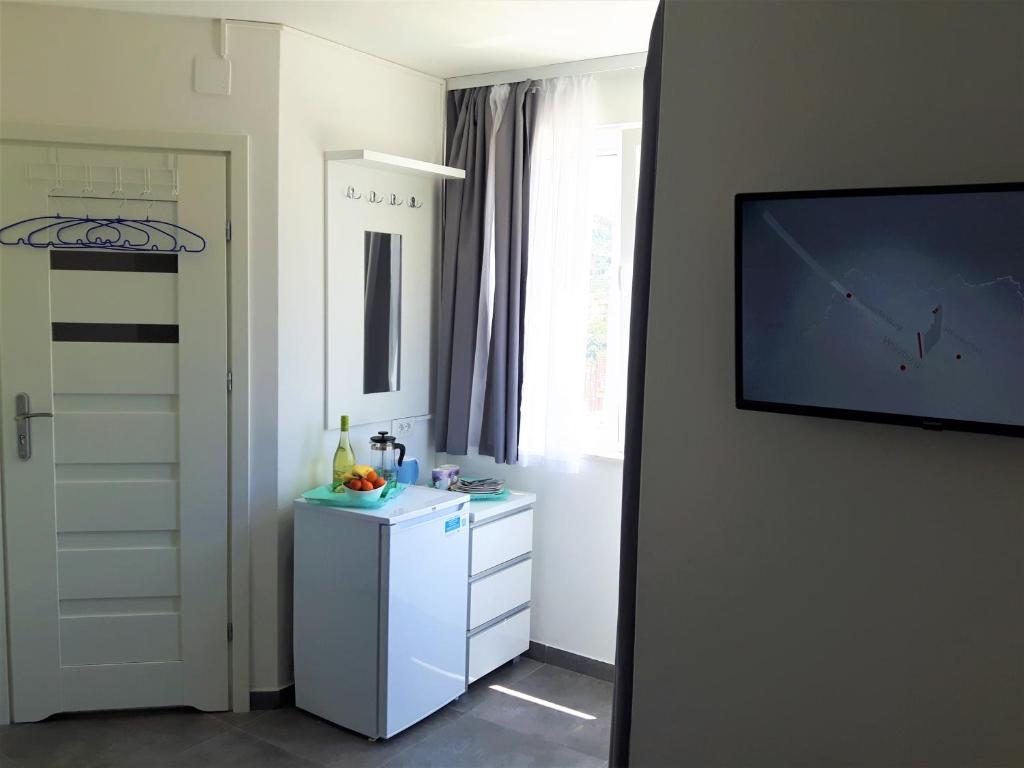 TV a/nebo společenská místnost v ubytování Apartmani Dalmacjia