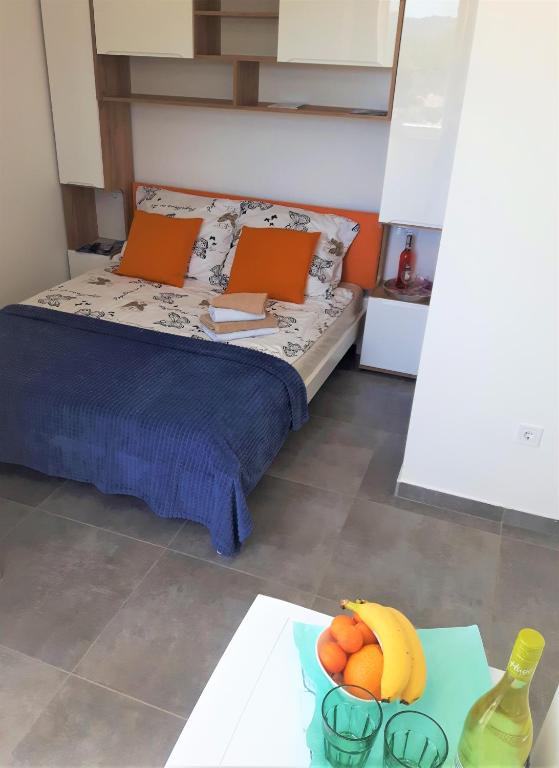 Postel nebo postele na pokoji v ubytování Apartmani Dalmacjia