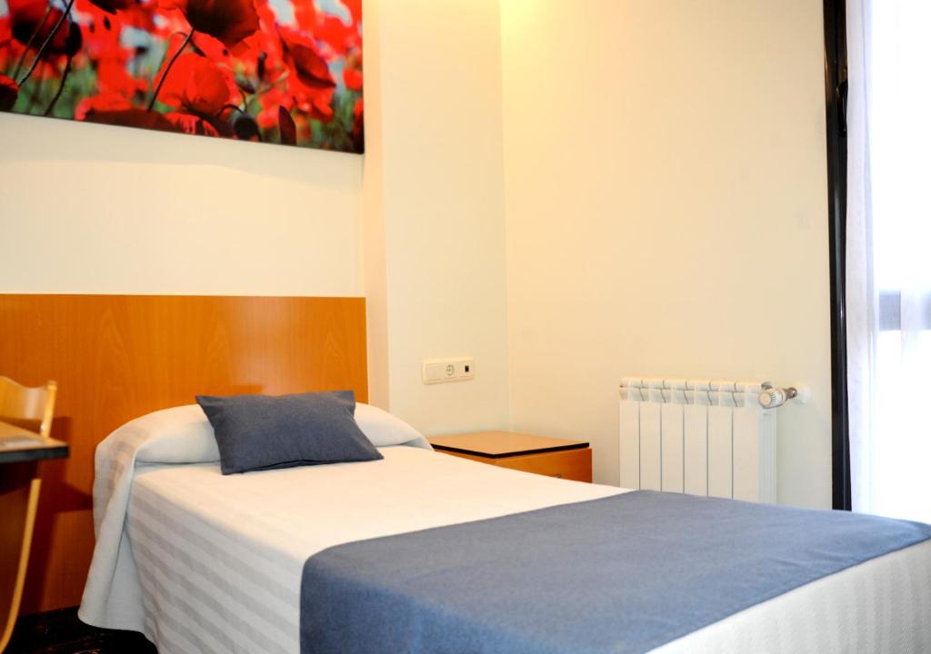 Postel nebo postele na pokoji v ubytování Hotel Aitana