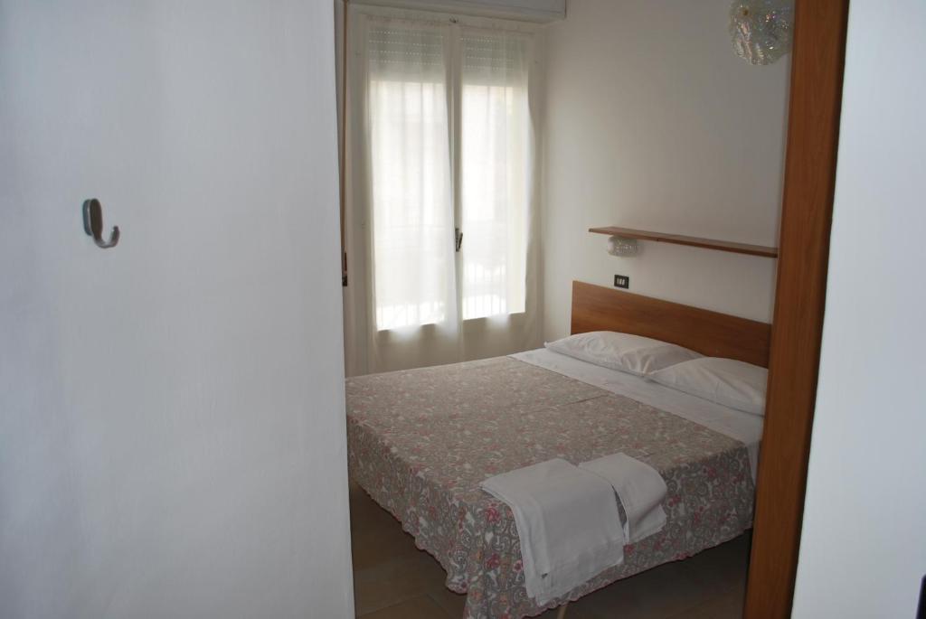 Postel nebo postele na pokoji v ubytování Hotel Numi