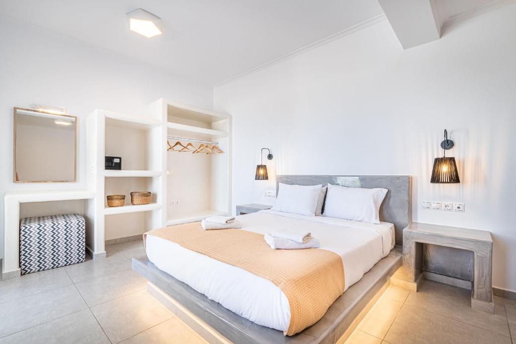 Postel nebo postele na pokoji v ubytování Caldera Stories private suites