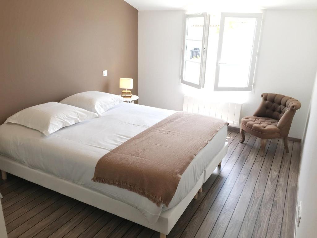 Postel nebo postele na pokoji v ubytování Hôtel Le Square