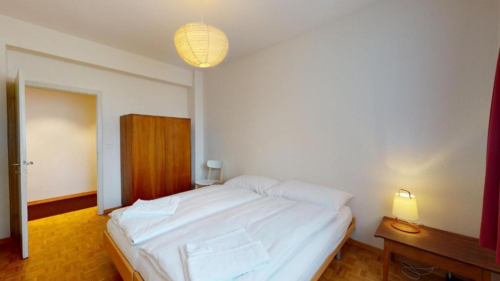 Postel nebo postele na pokoji v ubytování Salet - St.Moritz