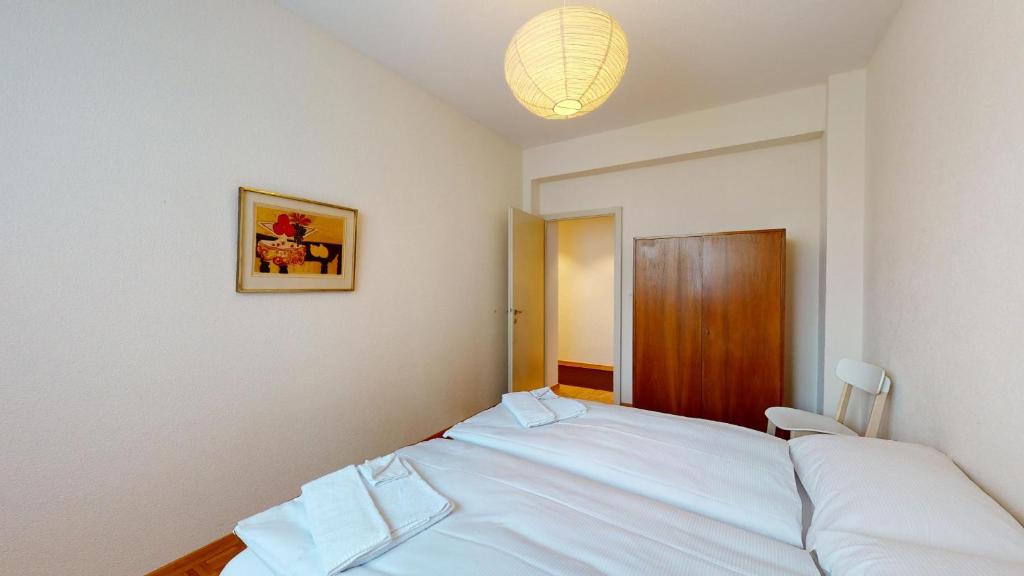Postel nebo postele na pokoji v ubytování Salet - St.Moritz