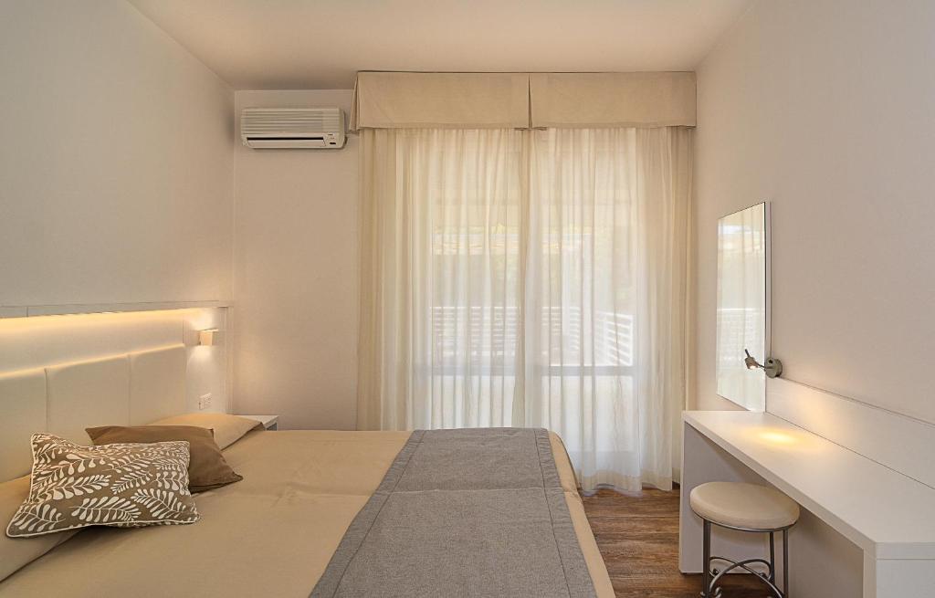 Postel nebo postele na pokoji v ubytování Hotel Hermitage