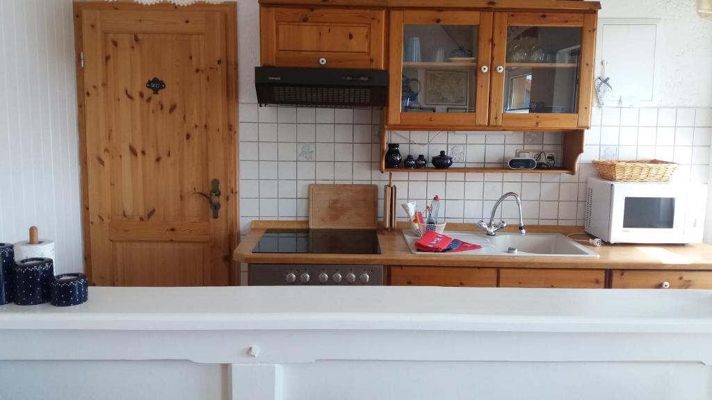 Kuchyň nebo kuchyňský kout v ubytování Ferienwohnung Insel Rügen