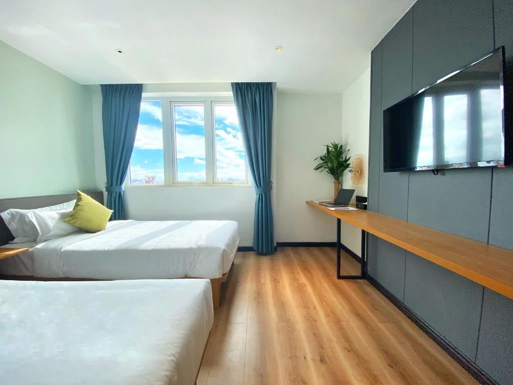 Postel nebo postele na pokoji v ubytování Yunfan Hotel