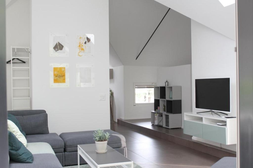 TV a/nebo společenská místnost v ubytování Casa Tua