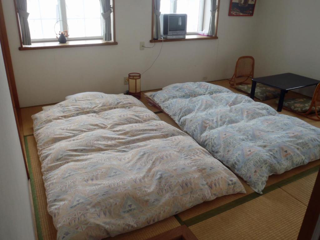 Postel nebo postele na pokoji v ubytování Mont Cervin Myoko