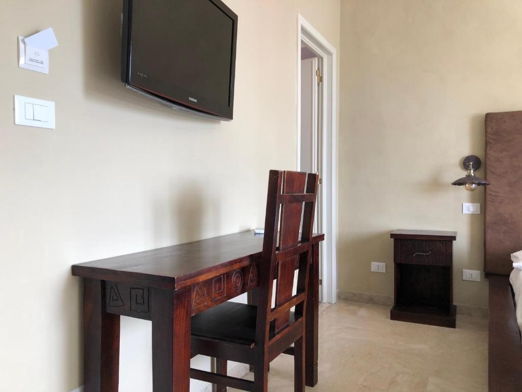 TV a/nebo společenská místnost v ubytování L'Attico di Piazza Mazzini Rooms