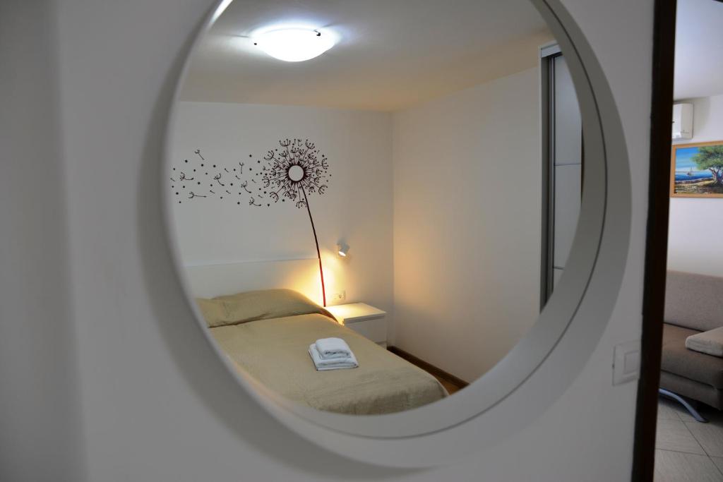 Postel nebo postele na pokoji v ubytování Apartments Palma & Pino