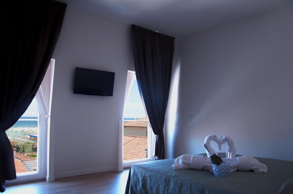 Postel nebo postele na pokoji v ubytování Hotel Ondina e Milazzo