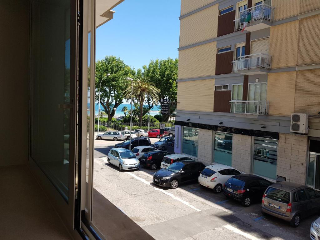 a view from a window of a parking lot with cars at RosAmar in Bari