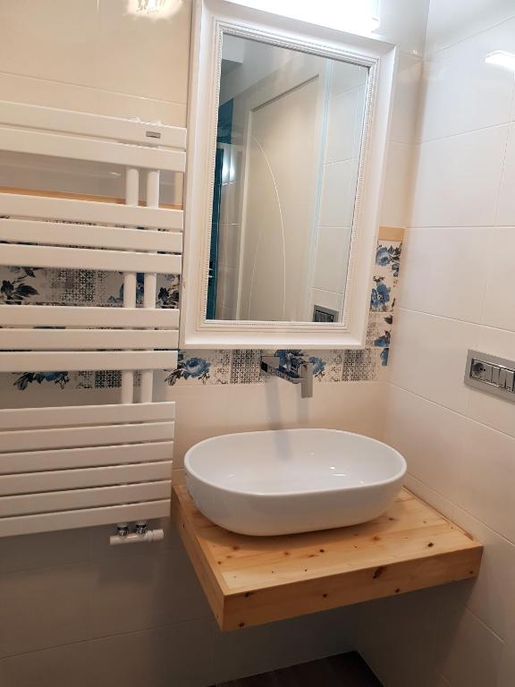 a bathroom with a white sink and a mirror at RosAmar in Bari