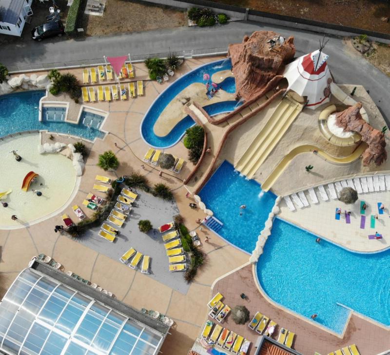 an aerial view of a water park with a swimming pool at Mobile Homes by KelAir at Camping Les Genets in Saint-Jean-de-Monts