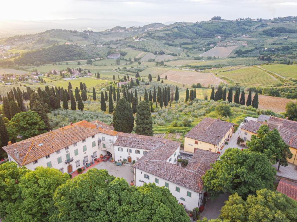 an aerial view of a villa in a vineyard at Agriturismo La Fattoria di Capezzana in Carmignano