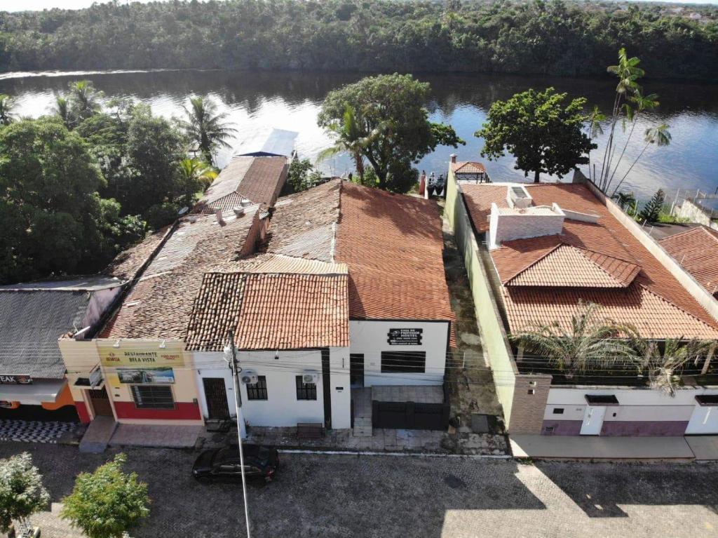 an aerial view of a house next to a river at Casa do Professor Hostel in Barreirinhas