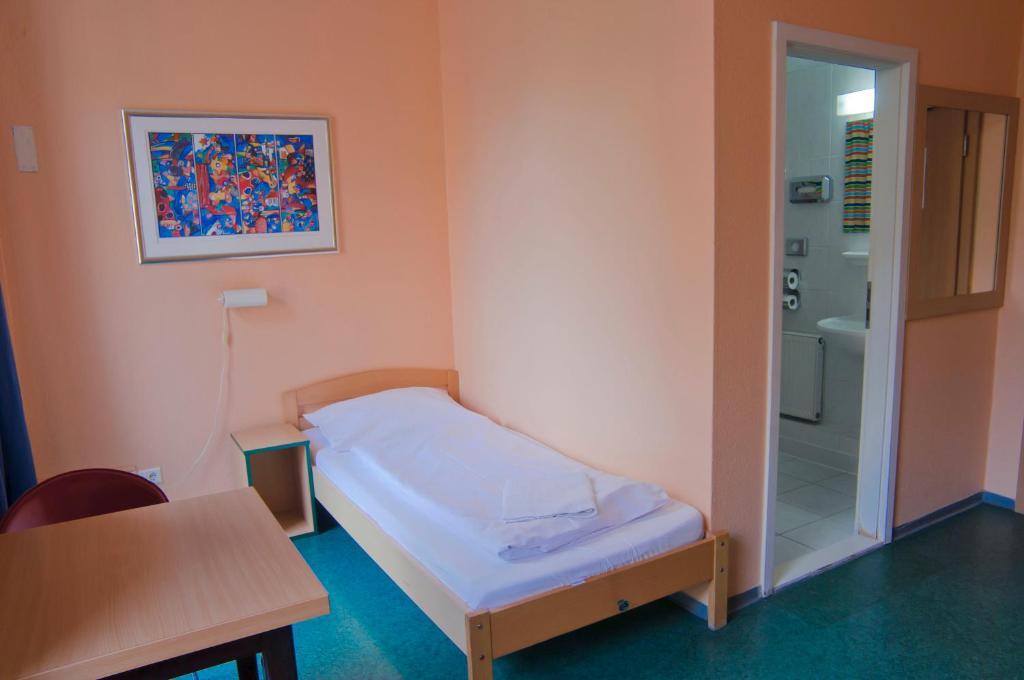 Postel nebo postele na pokoji v ubytování Happy Hotel Berlin