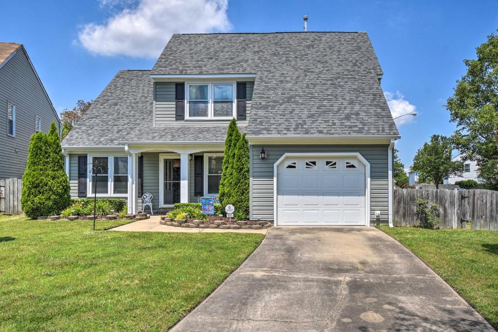 a house with a garage and a fence at Virginia Beach Family House Less Than 1 Mi to Golf Club! in Virginia Beach