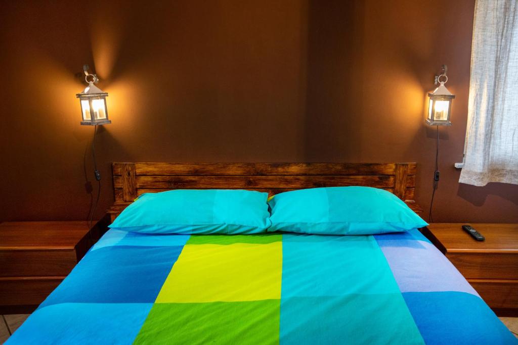 Postel nebo postele na pokoji v ubytování Baite Etna Bottino